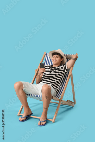 Young man using mobile phon...