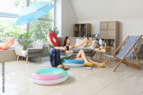 Young woman with beach acce...