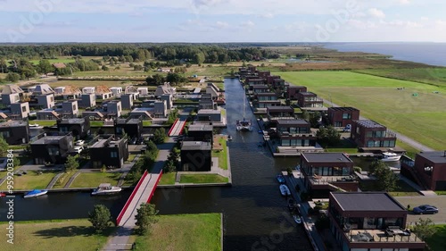 Svencele Village on the Bank of the Curonian Lagoon, Lithuania Water Sport Recreation Area, Kitesurfing, Windsurfing, Kayak, Wakeboarding Aerial Shot. Svencele Dune New Development Residential Buildin photo