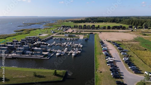 Svencele Village on the Bank of the Curonian Lagoon, Lithuania Water Sport Recreation Area, Kitesurfing, Windsurfing, Kayak, Wakeboarding Aerial Shot. Svencele Dune New Development Residential Buildin photo