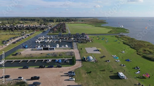 Svencele Village on the Bank of the Curonian Lagoon, Lithuania Water Sport Recreation Area, Kitesurfing, Windsurfing, Kayak, Wakeboarding Aerial Shot. Svencele Dune New Development Residential Buildin photo