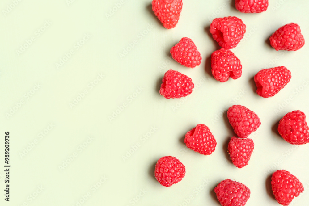 Many fresh raspberries on light green background Many fresh raspberries on light green background