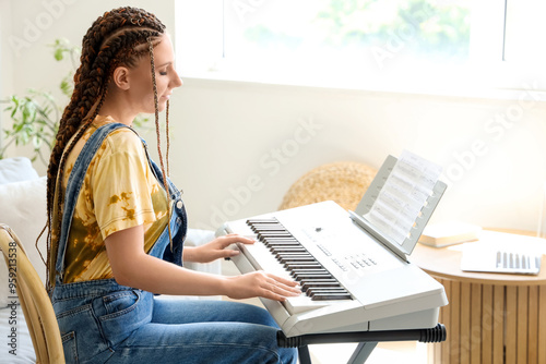 Young woman with dreadlocks...