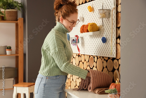 Young woman with knitted sc...