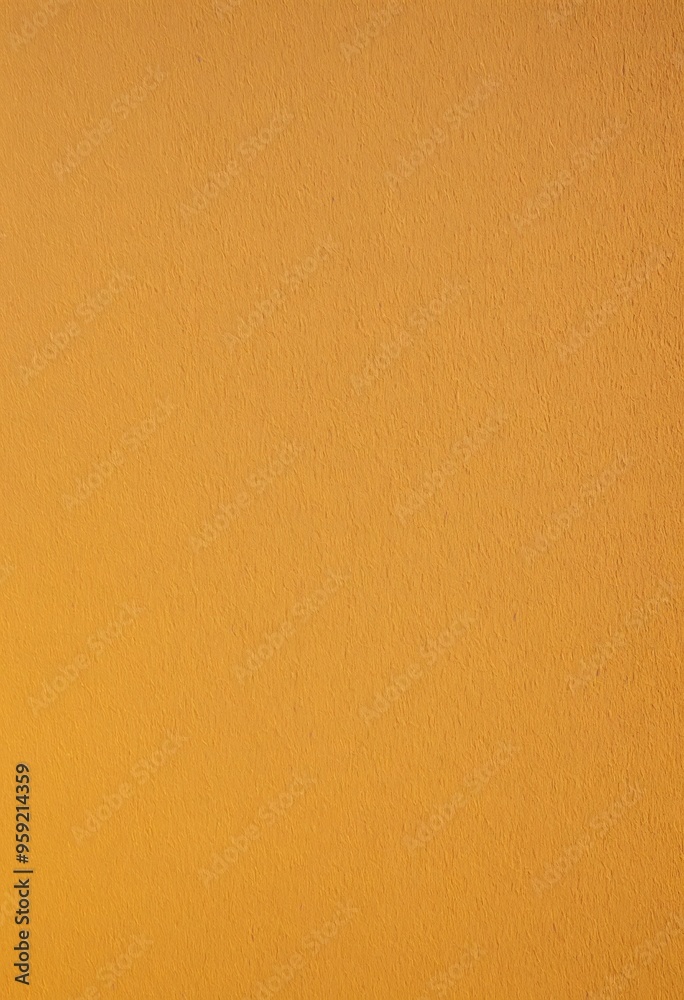 A vibrant close-up of a bright orange wall with a rough texture.