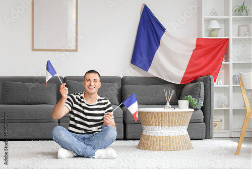 Young man with flags of Fra...