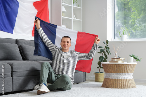 Young man with flag of Fran...