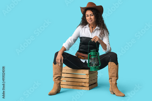 Young woman in cowboy hat a...