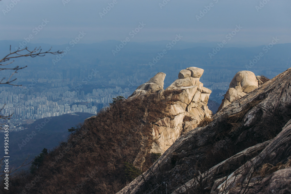 Fototapeta premium Bukhansan National Park, Seoul, Gyeonggi-do, South Korea, spring landscape view during hike to Baegundae summit peak, process of trekking and climbing to Bukhan mountain, travel and hiking in Korea