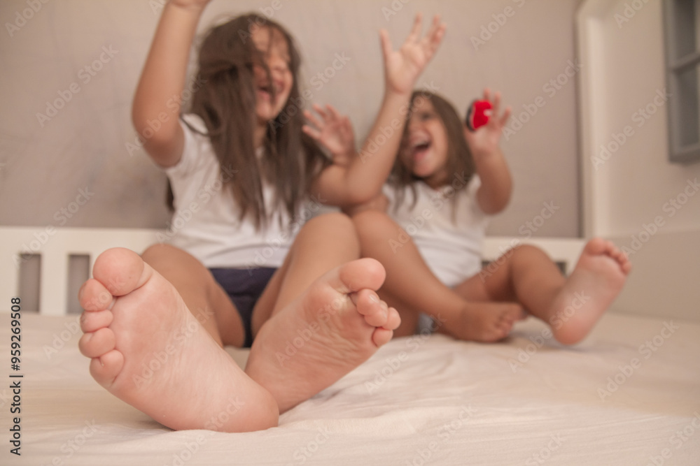 little girls playing in their room and tickling and hugging each other little girls playing in their room and tickling and hugging each other