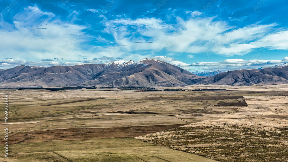The way to Lake Ohau and the southern alps through alpine grasses and tundra terrain The way to Lake Ohau and the southern alps through alpine grasses and tundra terrain