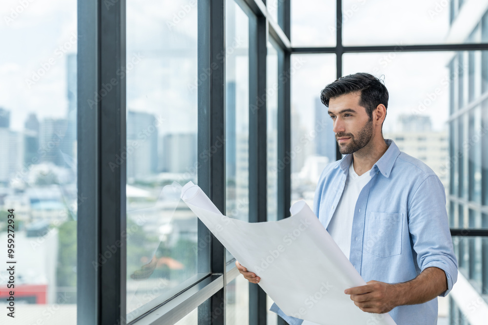 Fototapeta premium Professional architect engineer or male worker in casual outfit looking at skyscraper and city view while holding project plan. Creative design, civil engineering, building construction. Tracery.