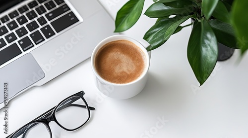 Serene Minimalist Workspace: Laptop, Coffee, and Reading Glasses Aerial View. Tranquil Productivity in Modern Office Aesthetics. photo