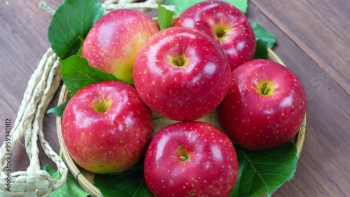 Fresh Red Japanese Apple in wooden bowl on wooden background, Shinano Red and Sansa  Apple in wooden basket