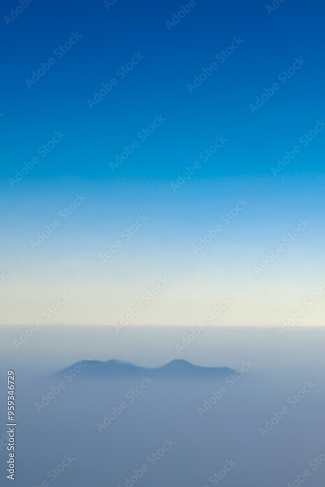 custom made wallpaper toronto digitalBlurry mountains in the clouds are hit by rays of light