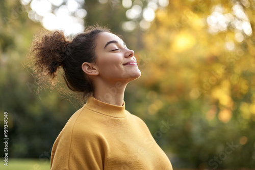 Wallpaper Mural Germany woman wearing yellow knitted sweatshirt in autumn park at sunny day Torontodigital.ca