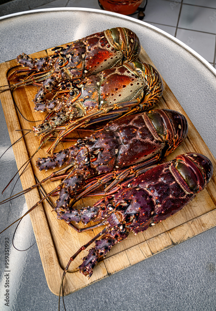 Food themes: Fresh lobsters on kitchen table.