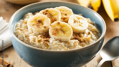 Oatmeal with Banana and Cinnamon: A closeup shot of a bowl of oatmeal topped with fresh banana slices and a sprinkle of cinnamon, capturing the essence of a healthy and delicious breakfast. 