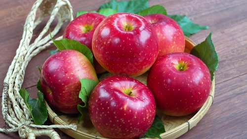 Fresh Red Japanese Apple in wooden bowl on wooden background, Shinano Red and Sansa  Apple in wooden basket