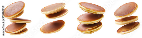 Pancakes flying close up on a white background.
