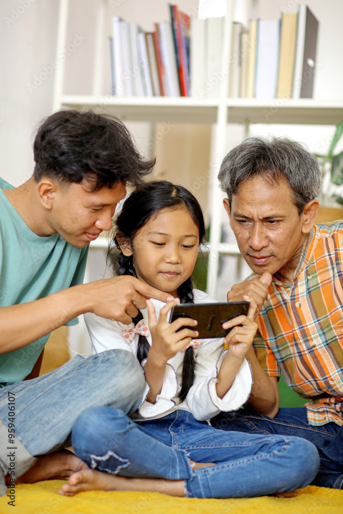 Portrait of Happy Asian Family Daughter Playing Games On Smartphone While Brother and Father Watching Smartphone Portrait of Happy Asian Family Daughter Playing Games On Smartphone While Brother and Father Watching Smartphone