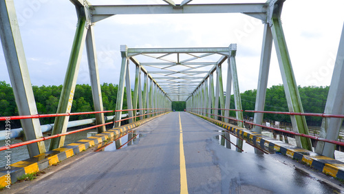 A Steel Construction Bridge Connecting The Village Of Perimping