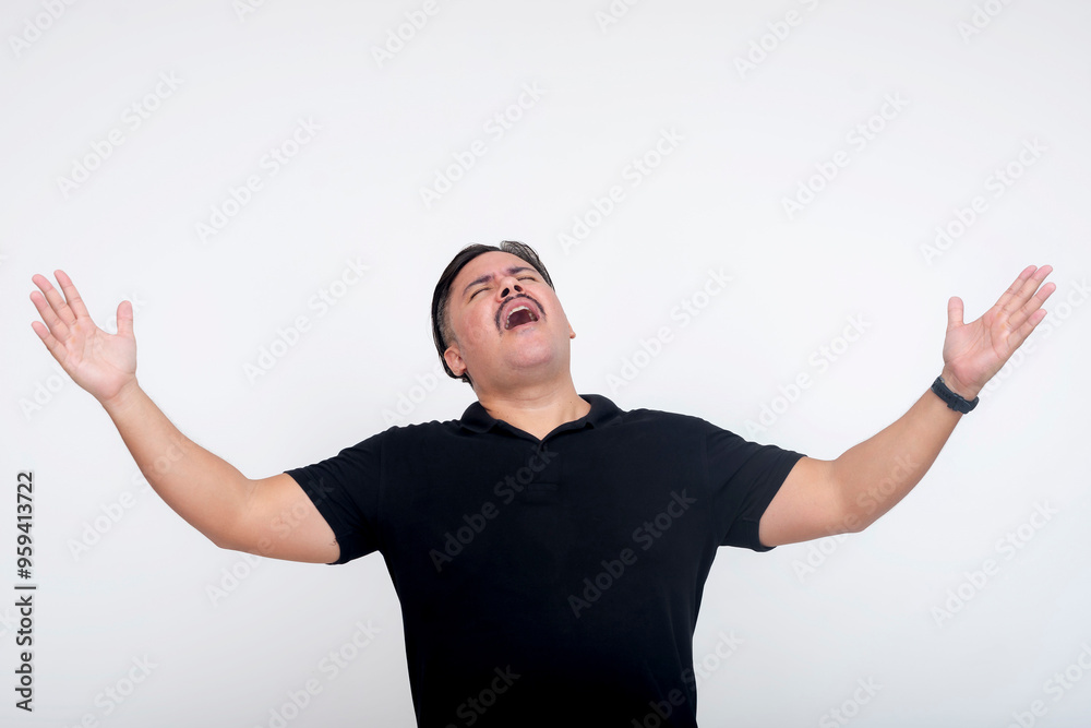 A triumphant man looking up and fervently declaring victory with wide open arms. Set against a white background. A triumphant man looking up and fervently declaring victory with wide open arms. Set against a white background.