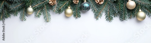 Elegant Christmas background featuring pine branches and festive ornaments, perfect for holiday designs and seasonal decor.