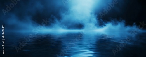 Dark blue water surface with fog and light reflection.