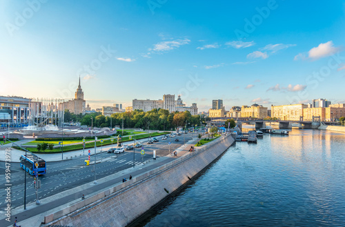 Panoramic view Borodinsky bridge, river Moscow, old buildings and high towers. View of the Borodinsky Bridge and the embankment in Moscow photo