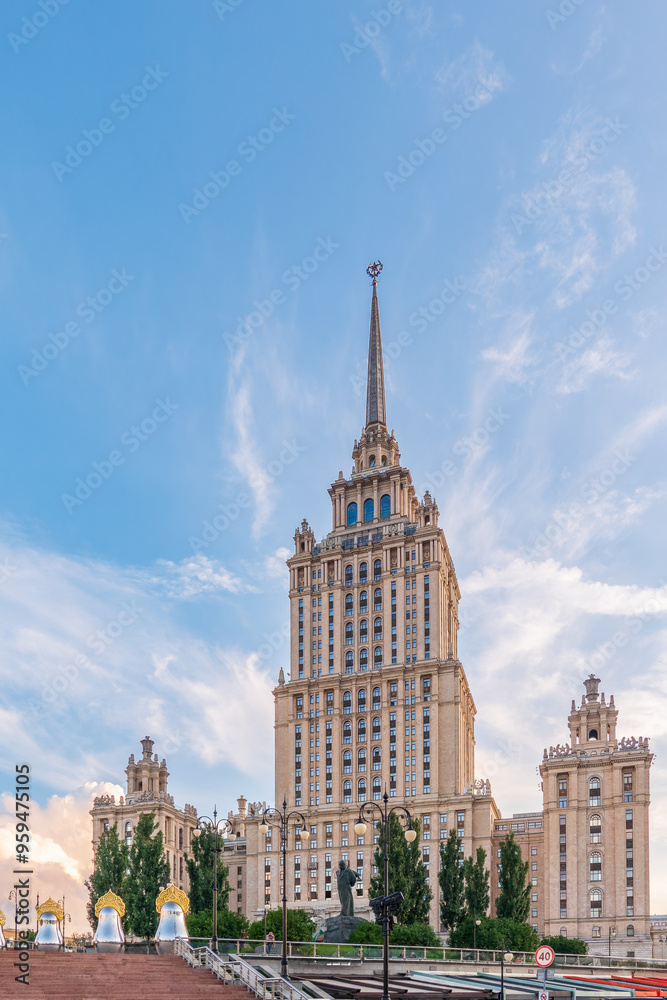 high-rise stalinist building near river at summer sunset in Moscow, Russia. Historic name is Hotel Ukraine. high-rise stalinist building near river at summer sunset in Moscow, Russia. Historic name is Hotel Ukraine.
