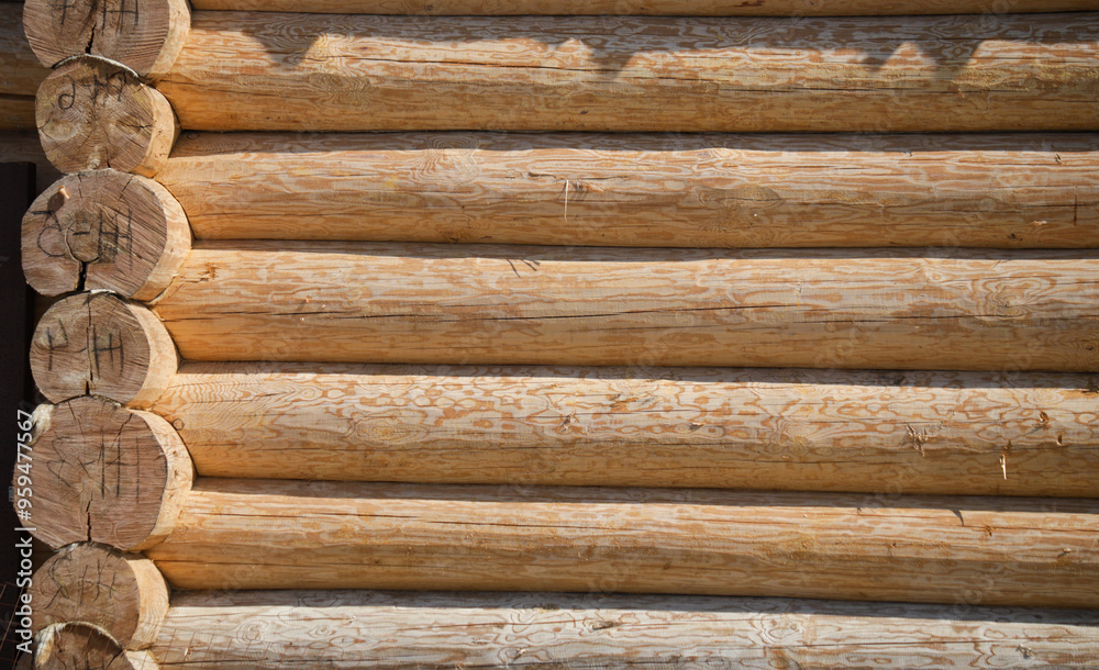 A wooden wall with many wooden logs A wooden wall with many wooden logs