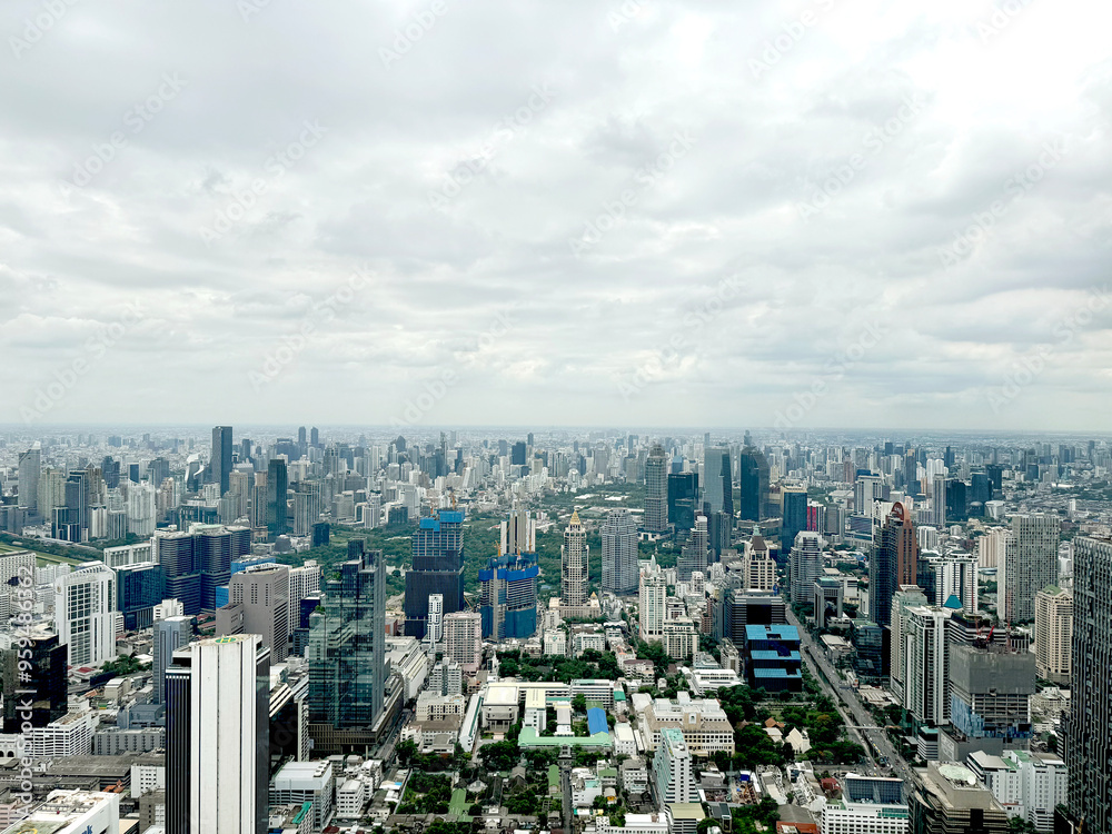 Fototapeta premium Aerial view of Bangkok skyline, Bangkok financial district, buildings and skyscrapers under sunny sky. Bangkok is the biggest and capital metropolitan city of Thailand.