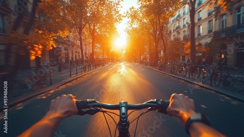 First-person view of hands on a bicycle handlebar riding through a Paris city street at sunset, with sunlight rays, trees, and buildings, capturing a summertime urban scene.

 photo