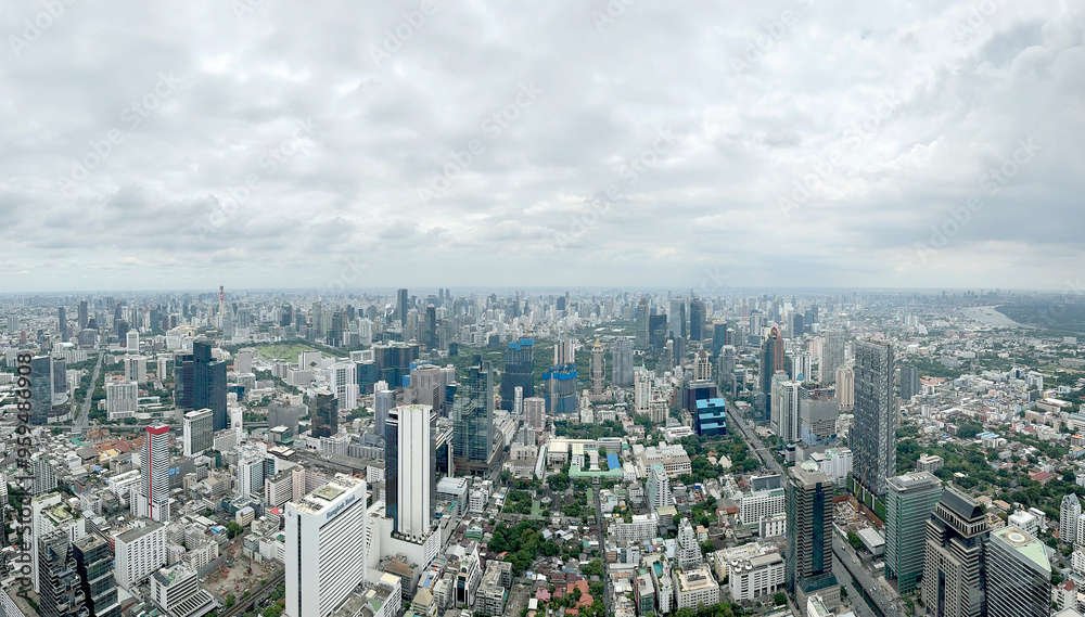 Aerial view of Bangkok skyline, Bangkok financial district, buildings and skyscrapers under sunny sky. Bangkok is the biggest and capital metropolitan city of Thailand. Aerial view of Bangkok skyline, Bangkok financial district, buildings and skyscrapers under sunny sky. Bangkok is the biggest and capital metropolitan city of Thailand.