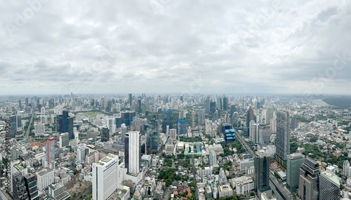 Aerial view of Bangkok skyline, Bangkok financial district, buildings and skyscrapers under sunny sky. Bangkok is the biggest and capital metropolitan city of Thailand.