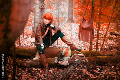 Mature model portraying a royal huntress with red curve hair resting after hunting with a crossbow in the in vibrant autumn forest in a thematic photo shoot photo