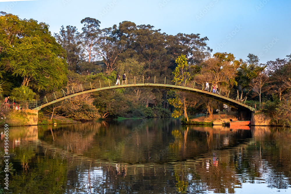Ibirapuera Park, Sao Paulo, SP, Brazil. People walk on the bridge over the river, in Ibirapuera Park, in the city of Sao Paulo.