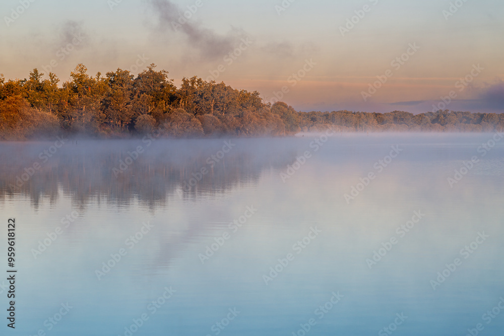 Landscape with the Valparaíso Reservoir, oak forests and fog in the background, Villardeciervos, Zamora, Castilla y León, Spain. Landscape with the Valparaíso Reservoir, oak forests and fog in the background, Villardeciervos, Zamora, Castilla y León, Spain.