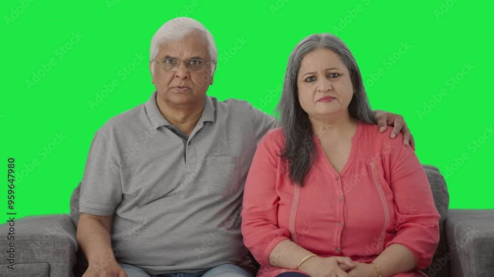 Frustrated Indian old couple looking at the camera Green screen Frustrated Indian old couple looking at the camera Green screen