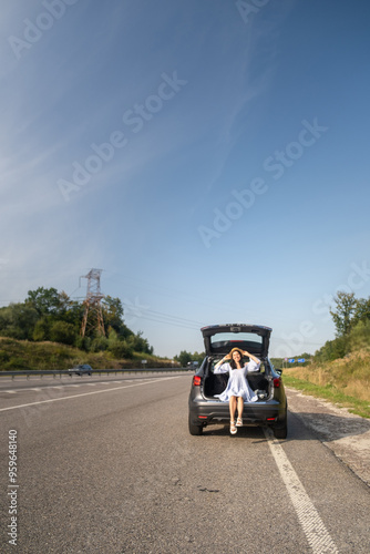Woman Enjoying a Sunny Day by Her Car