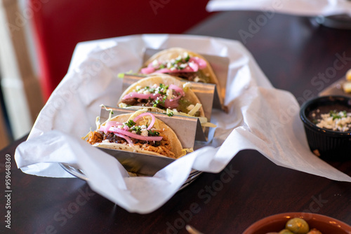 Tacos in a serving tray on table photo