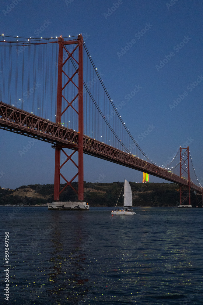 Beautiful view to 25 de April Bridge over Tejo River on early night. Beautiful view to 25 de April Bridge over Tejo River on early night.