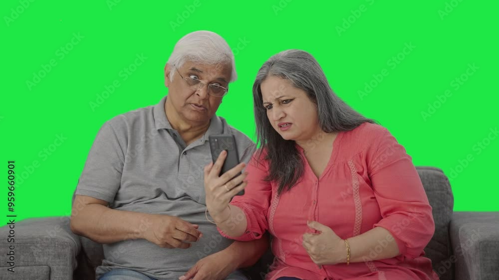 Angry Old Indian couple shouting on video call Green screen Angry Old Indian couple shouting on video call Green screen