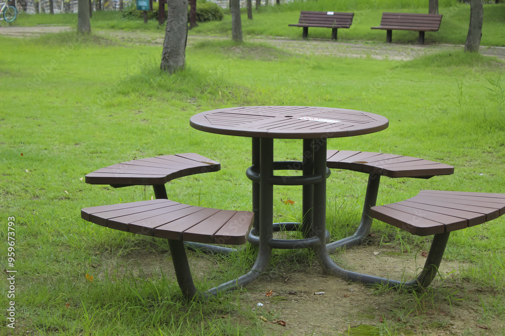 bench and table in the park empty in late summer