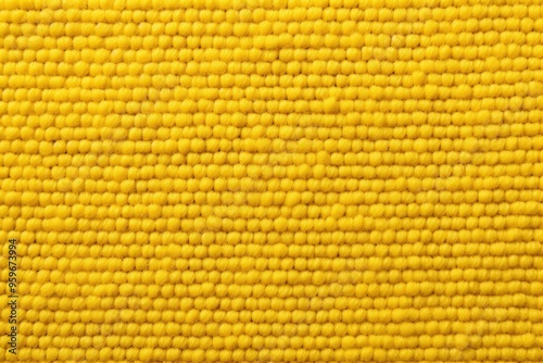 Yellow close-up of monochrome carpet texture background from above. Texture tight weave carpet blank empty pattern with copy space for product 