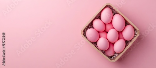 Pink Easter eggs in a woode...