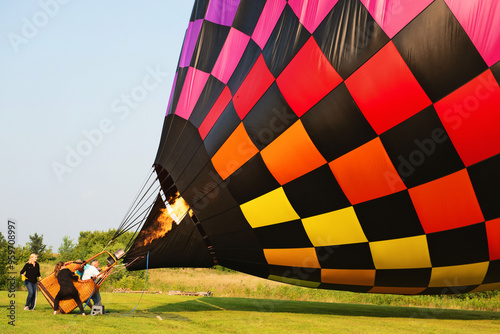 Crew inflating a hot air balloon.