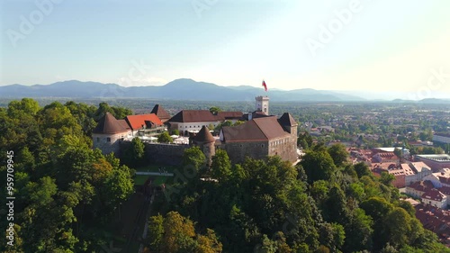 Stunning drone footage of Ljubljana, Slovenia, showcasing the charming old town, the medieval castle, and the vibrant city center with its picturesque streets and unique architecture. photo