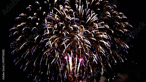 Stunning fireworks bursting in the night sky, filling the air with vibrant colors and dazzling patterns, creating a beautiful and captivating display